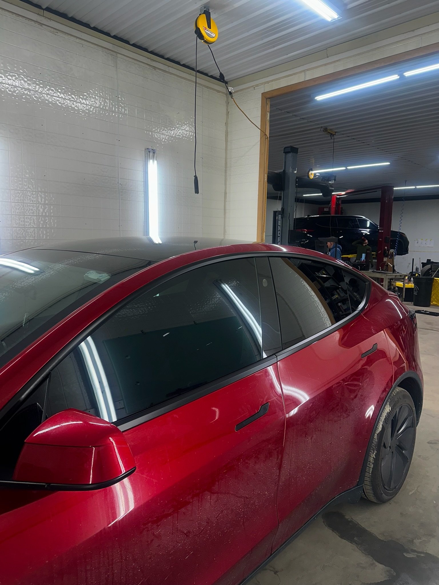 Tesla window tint closeup door glass edge precision install — Garage 717 Myerstown PA